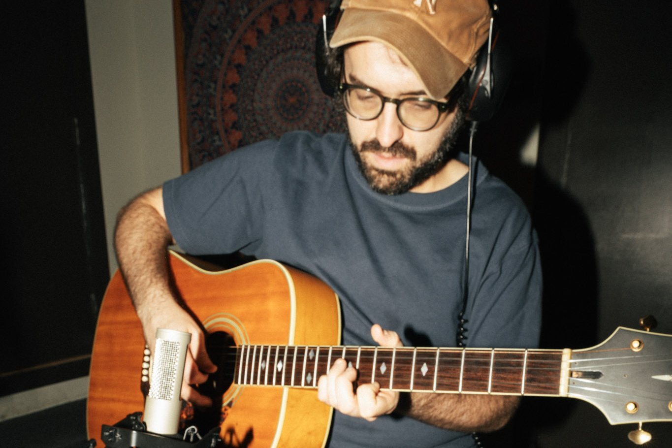 Anthony Da Costa playing a Nashville-strung acoustic guitar into a Royer R-12 ribbon microphone