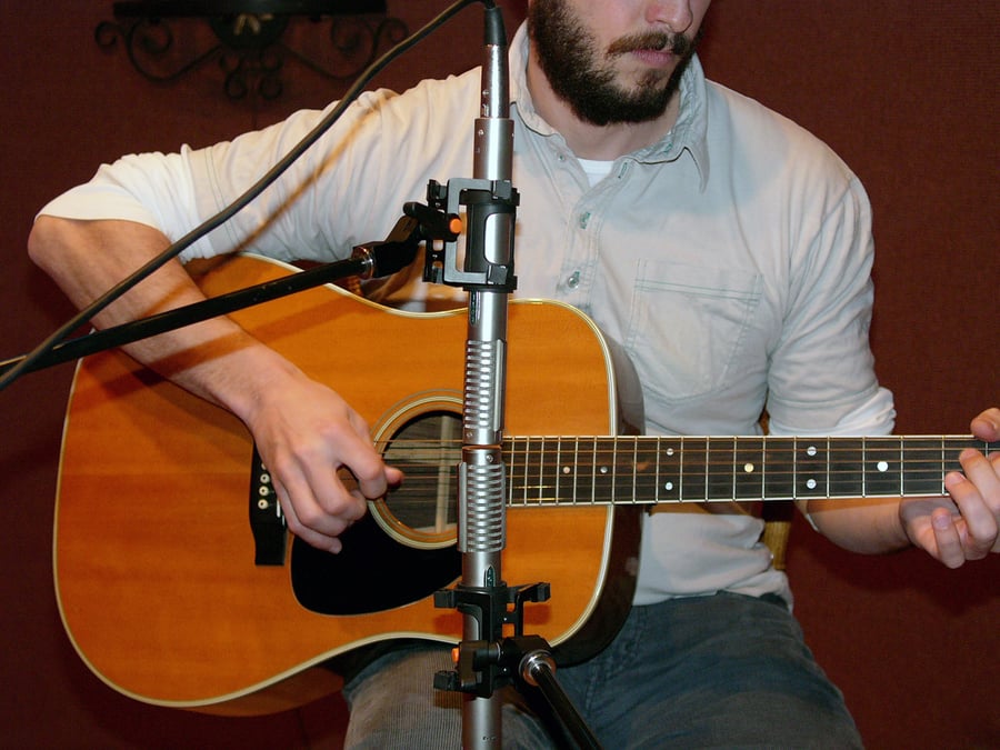 Two R-122s set up head-to-head in Blumlein configuration on an acoustic guitar