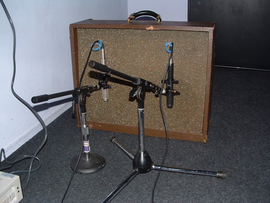 R-121s on a guitar cabinet at a Train session