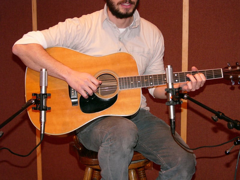 A spaced pair of R-122s on an acoustic guitar