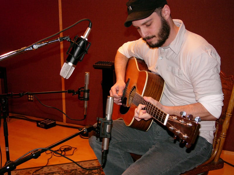 Wide spaced R-122s, one near the top of the neck and one near the end of the body, with a Mojave Audio MA-200 in the middle