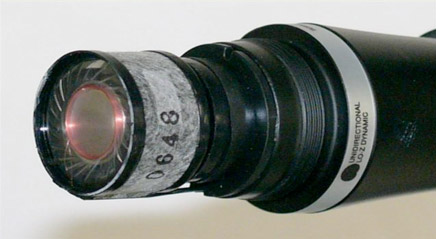 A dynamic microphone opened up to show its voice coil